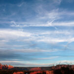 Picture of the Arizona sky with oddly-patterned white clouds.