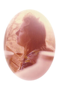 Image of my mom sitting on the porch contemplating in 1978