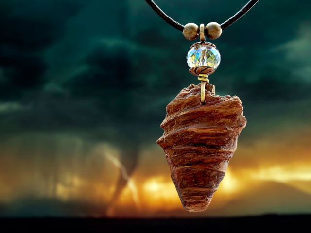 Image of necklace against a stormy background